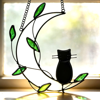 Vitrail attrape-soleil en forme de lune et de chat aux feuilles vertes