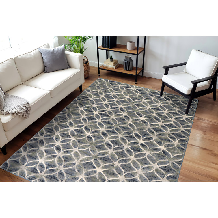 Tapis bleu à motif géométrique Majeski