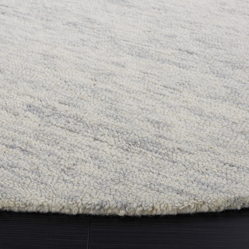 Estilla Metro Hand Tufted Wool/Cotton Solid Color Rug in Ivory, Round 6'
