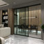 Paravent à panneau coulissant en verre transparent - Structure en aluminium avec technologie Silent Glide-49164654-91951230-126699390