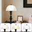 Lampe de table colonne romaine avec abat-jour en verre givré et base en métal noir