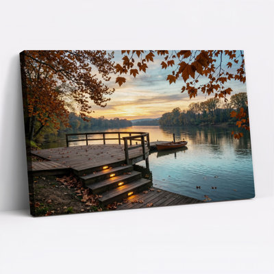 Tableau sur toile « Feuilles d'automne et quai en bois au coucher du soleil »