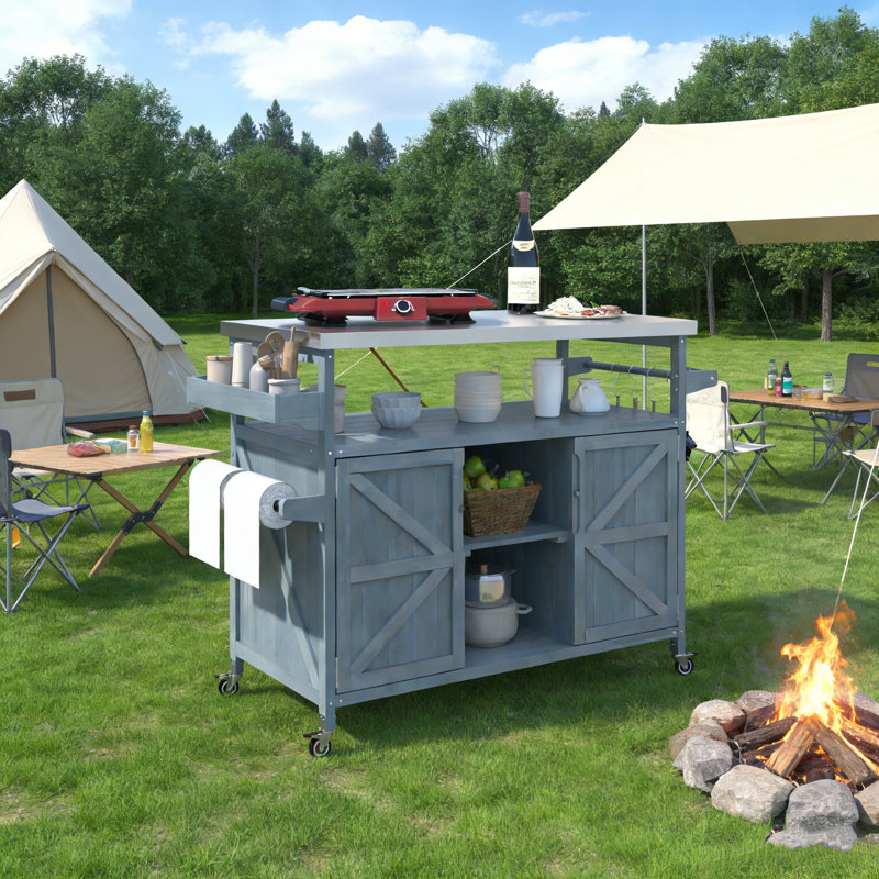 Rolling Outdoor Kitchen Island with Stainless Steel Top, Ample Storage, and Modular Design for Patio Grilling and Entertaining.