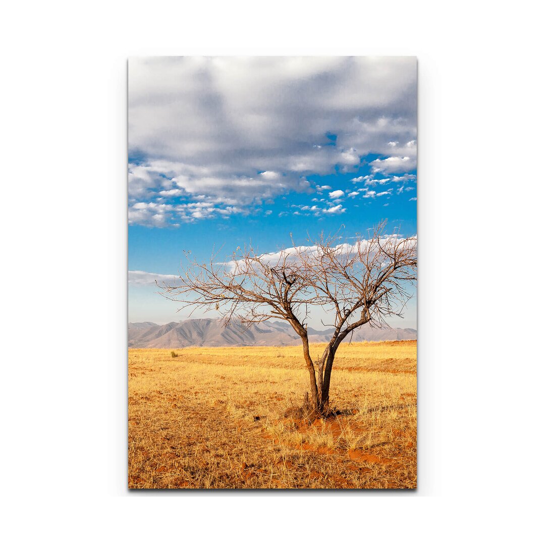 Leinwandbild Kahler Baum in der afrikanischen Savanne