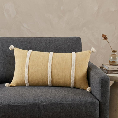 Coussin en coton 14 "x 26" blanc et jaune avec des pampilles