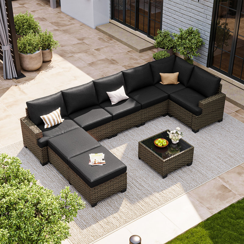Ensemble de conversation modulaire de patio 9 pièces en résine tressée spéciale PE avec coussins de 10 cm et table basse