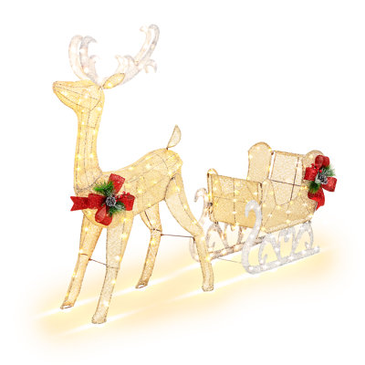 Renne de Noël illuminé et traîneau du Père Noël