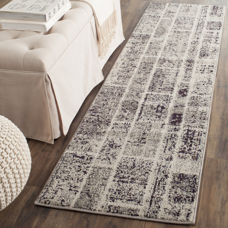 Tapis à motif géométrique gris Amrane