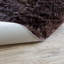 Tapis brun foncé en fausse fourrure Diller-908860377