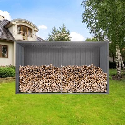 La nouvelle remise de rangement extérieure 13 x 11 pi possède deux fonctions: une remise en métal et une remise à bois de chauffage, plus adaptée à l'hiver, gris