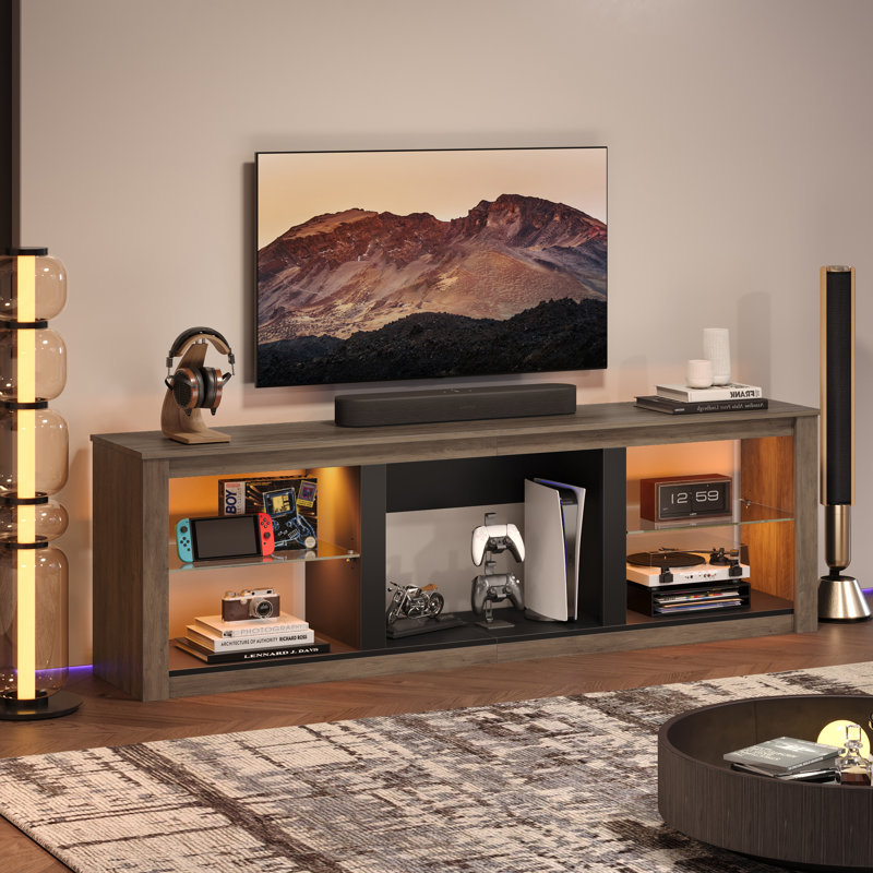 Kruszewski 70" TV Stand Fits TVs Up To 75" with LED Lights Glass Shelves and Open Storage, Gray Wash