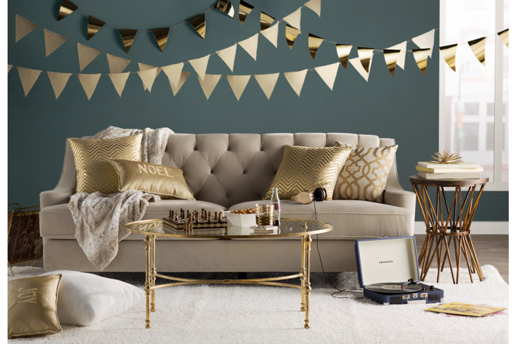beige sofa with board games on coffee table