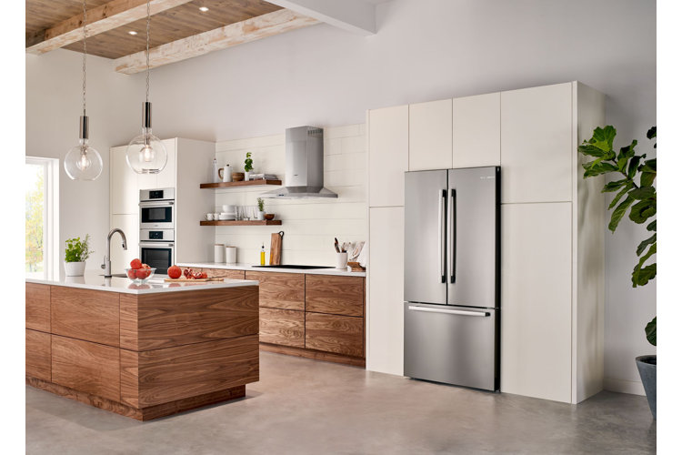 silver counter-depth refrigerator in modern, white kitchen
