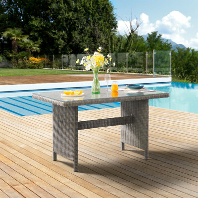ASTI 55" Wide 30" Height All-Weather Wicker Outdoor Cocktail Table With Glass Top by Bayou Breeze