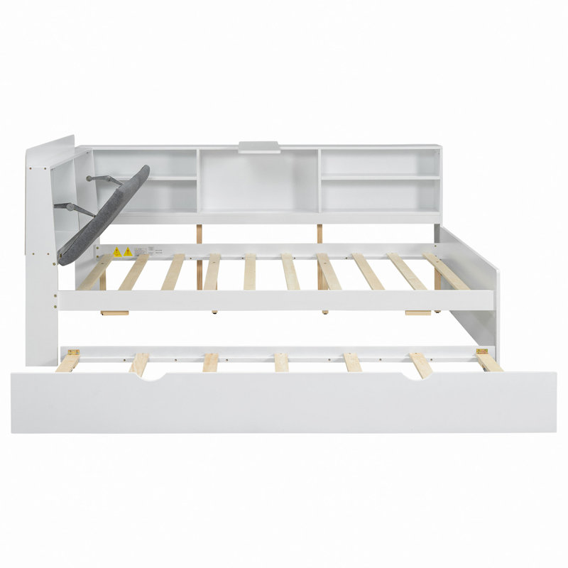 Lit plateforme en bois avec lit gigogne, tablettes et tête de lit