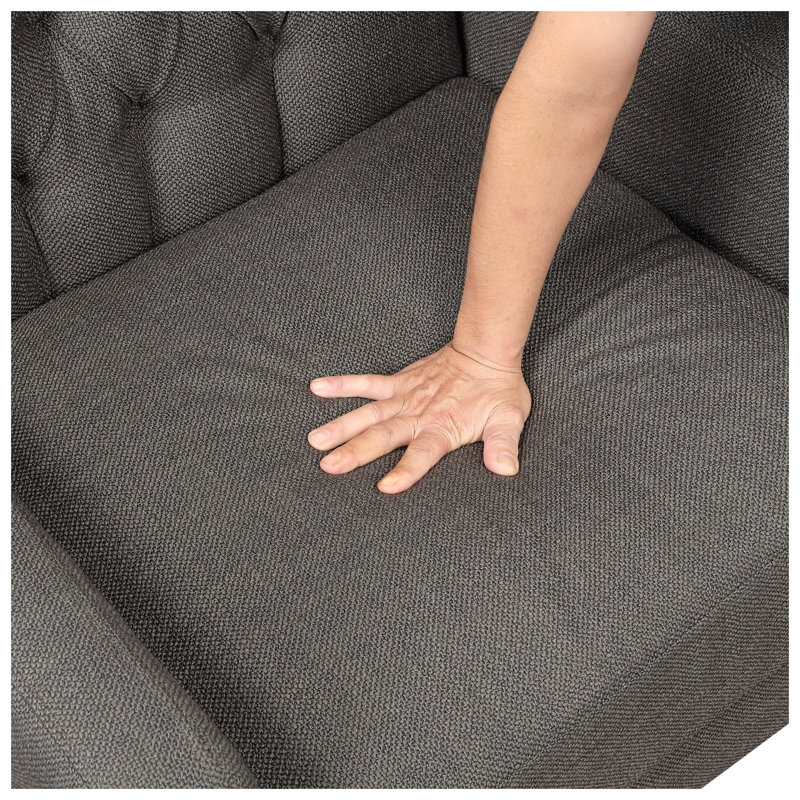 Fauteuil à oreilles classique avec dossier capitonné, revêtement gris foncé et pieds en bois massif
