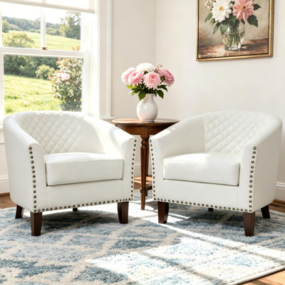 Fauteuil demi-tonneau capitonné en similicuir Edvardas