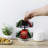 Black Rotating Tabletop Tea Storage With Wood Base