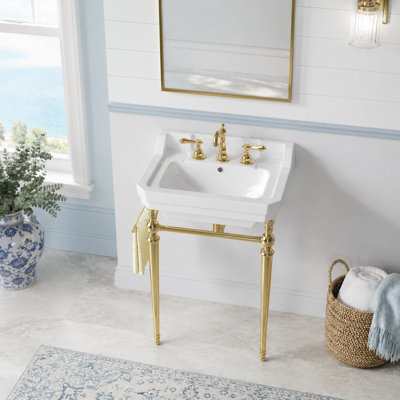 Ensemble de meuble-lavabo autoportant en céramique avec support en métal doré et barre à serviettes latérale