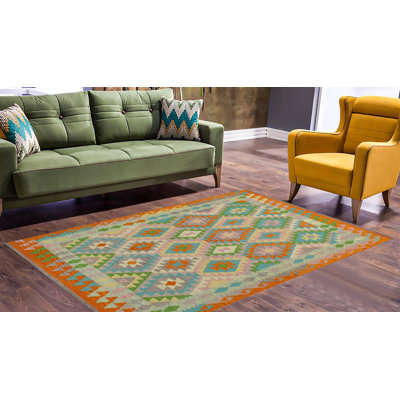 Kemarley Geometric Handmade Hand-Woven Rectangle 4'3'' x 5'9'' Wool Area Rug in Purple/Orange/Green