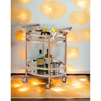 Oval Serving Cart In Clear Glass And Rose Gold Finish, 2 Shelves Open Storage, 5mm Tempered Top Shelf, 3mm Mirror Base Metal Frame With Handles, Caster Wheels, Structure, Plastic Wheels For Floor ,