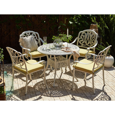 Helland 4 - Person Patio Dining Set with Round Table , Cushions Included