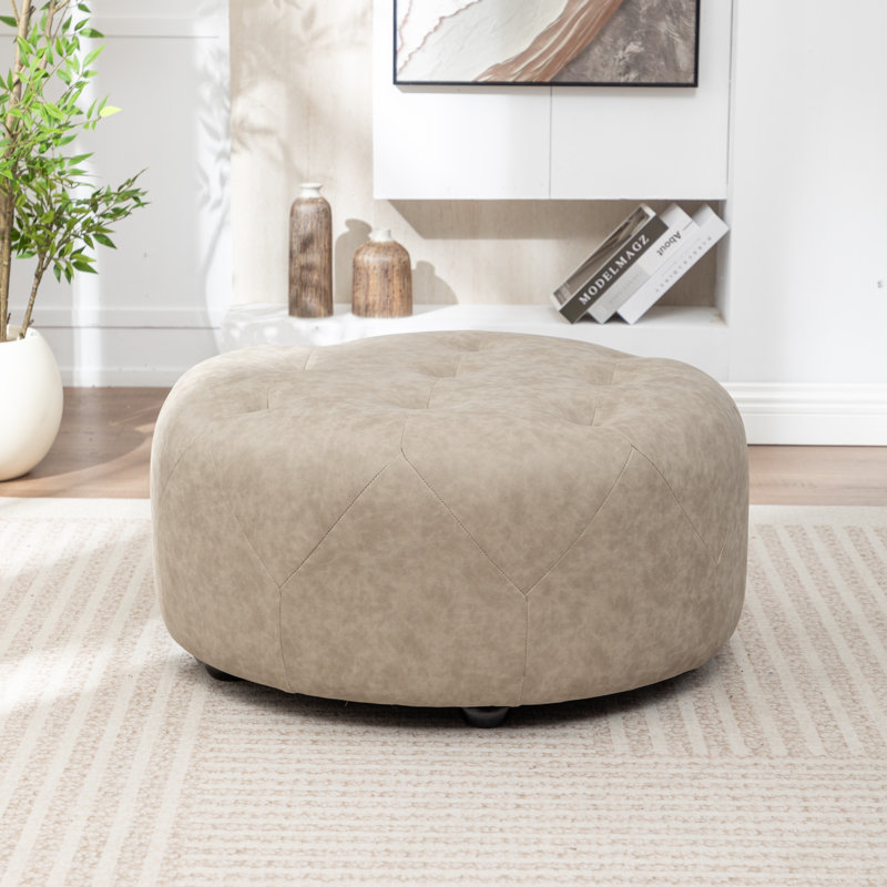 Castanedo Upholstered Round Ottoman, Polyester - Taupe