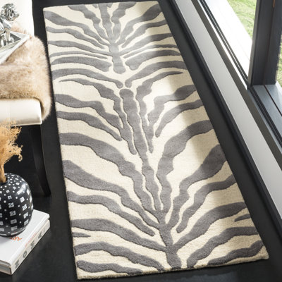 Carevelle Animal Print Wool Hand Woven Area Rug
