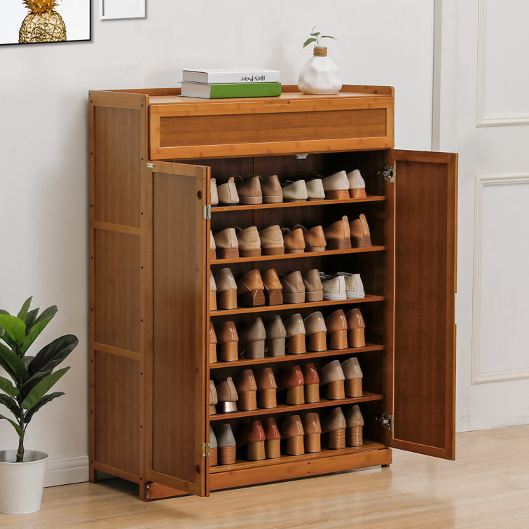 https://assets.wfcdn.com/im/05104531/resize-h755-w755%5Ecompr-r85/2021/202124218/7+Tier+Organizer+Bamboo+Cabinet+Shoe+Rack+with+Folding+Door%2C+30+Pairs+of+Shoes+Stand+for+Hallway.jpg