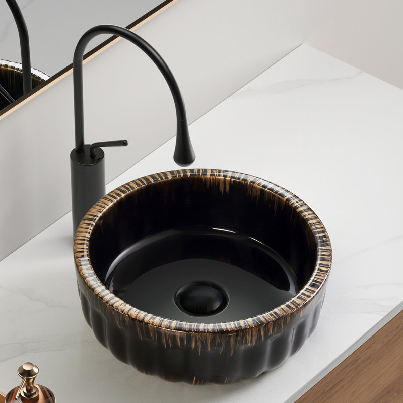 Lavabo de salle de bain noir en céramique durable, conception de vasque moderne, idéal pour les espaces compacts