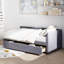 Lit simple tapissier gris avec design en forme de L-1540130931