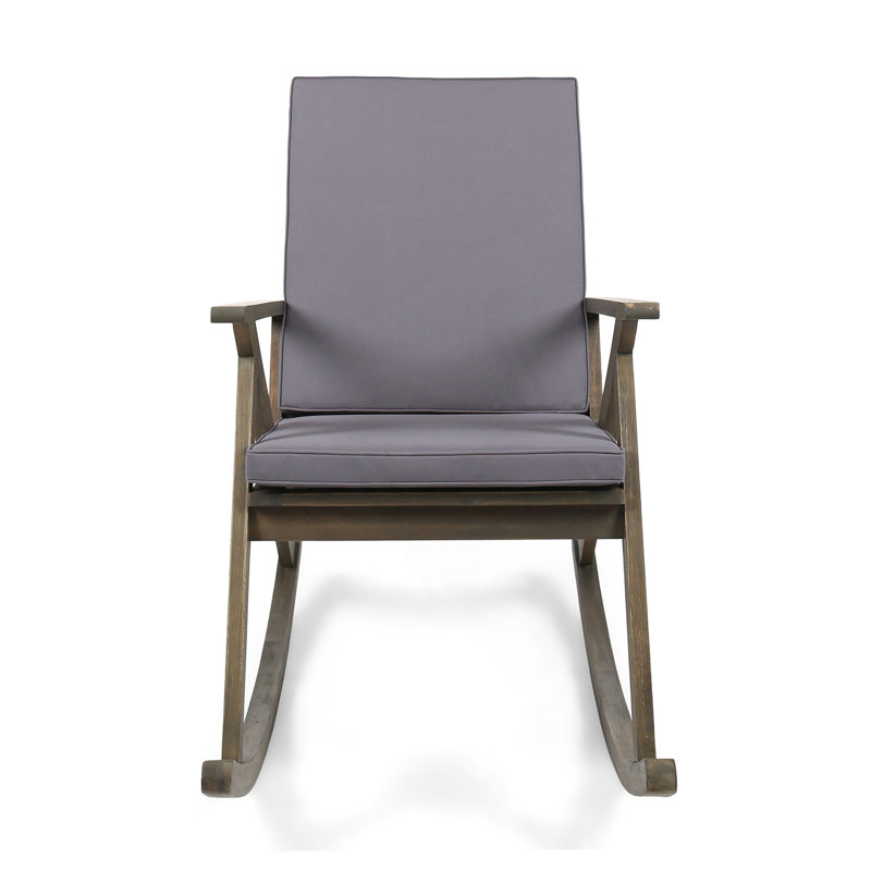 Chaise berçante avec structure en bois d'acacia durable, courbes ergonomiques et polyvalence intérieure-extérieure pour une détente ultime.