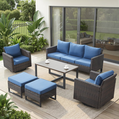 7 Piece Outdoor Wicker Seating Set: Sofa, 2 Swivel Chairs, 2 Ottomans & Side Table