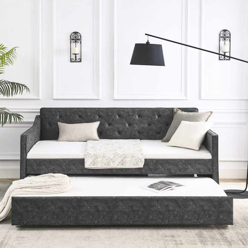 Lit de jour gris avec couchette simple, accoudoirs élégants, revêtement en tissu confortable, structure solide