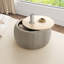 Repose-pieds rond avec rangement Dariyan-944897202