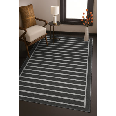Tapis noir tissé à rayures Mosso