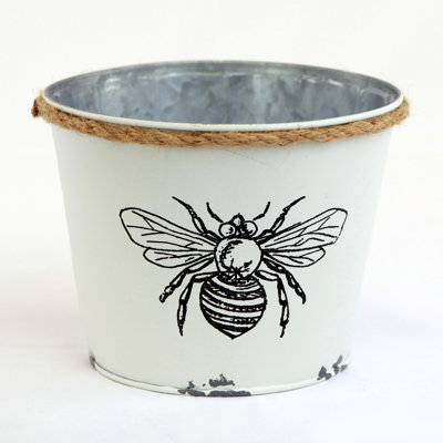 Pot à fleurs blanc avec abeille noire
