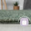 Lush shaggy carpet in  green-341375986