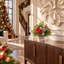 Festive holiday arrangement with greens and Berries