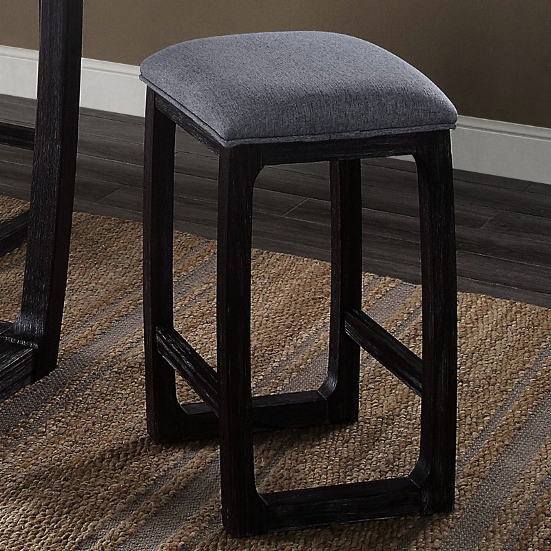 Tabouret invitant à hauteur de comptoir en tissu gris et patiné