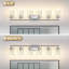 Applique murale de salle de bain à 6 lumières, fini nickel argenté brossé, abat-jour cylindrique en verre transparent, idéale pour les hôtels et les salles de bain principales.