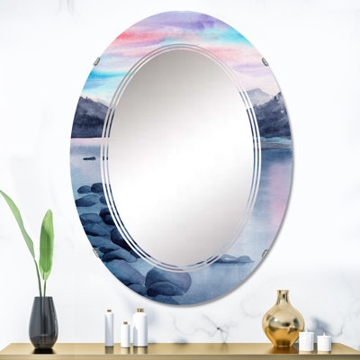 Un paysage de soirée avec un phare - miroir mural nautique et côtier ovale