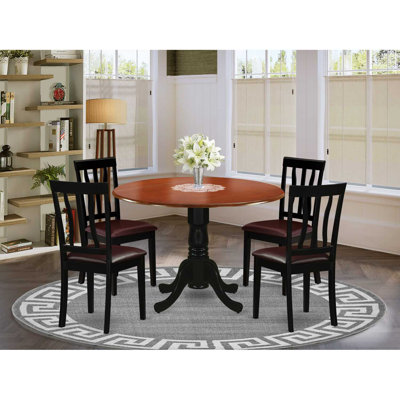 L'ensemble de mobilier de salle à manger 5 pièces comprend une table de cuisine ronde avec Dropleaf et 4 chaises de salle à manger rembourrées en similicuir de 42 po x 42 po, noir et cerise