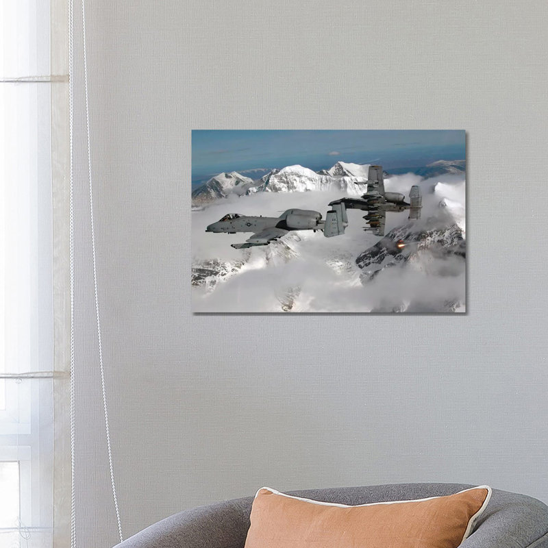 A-10 Thunderbolt IIs Fly Over Mountainous Landscape by Stocktrek Images - Wrapped Canvas Print