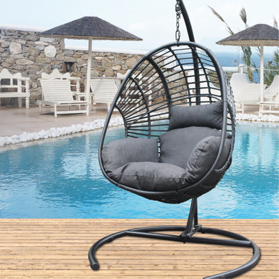 Balancelle d'extérieur en PE noir avec coussin et base colorés, assise moelleuse gris foncé, coussin tissé à la main, technique de tissage volumineux à la main