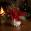 Holiday Magnolia Arrangement with Evergreen and Berries in Decorative Ceramic Vase