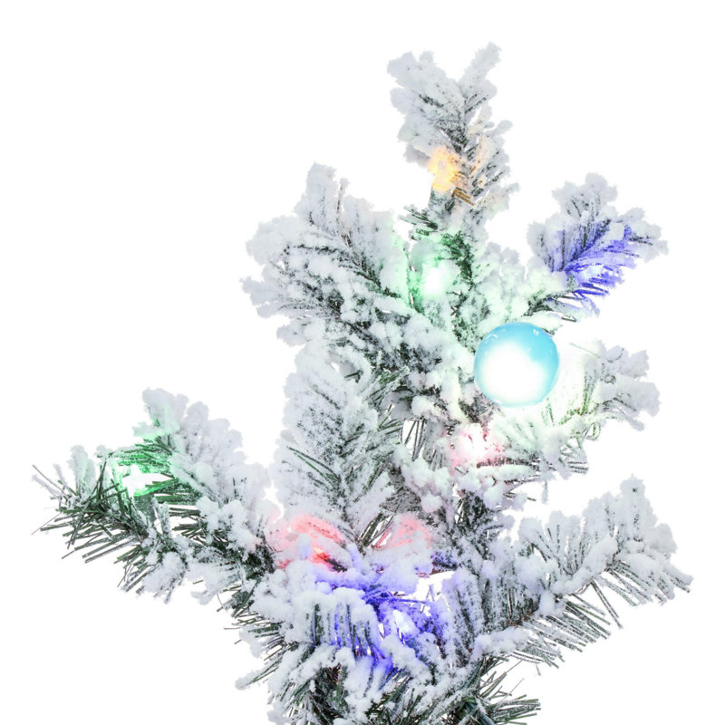 Vickerman 10' x 82" Flocked Alaskan Artificial Pre-Lit Christmas Tree with 91 Warm White G50 and 1200 Warm White LED Mini Lights, 2911 Flocked Realistic PVC Tips, 6' Step On/Off Power Cord and Folding Metal Tree Stand. Assembly is required.