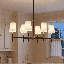 Lustre linéaire à 6 lumières Timiki en noir mat avec accents laiton chaleureux-70337277