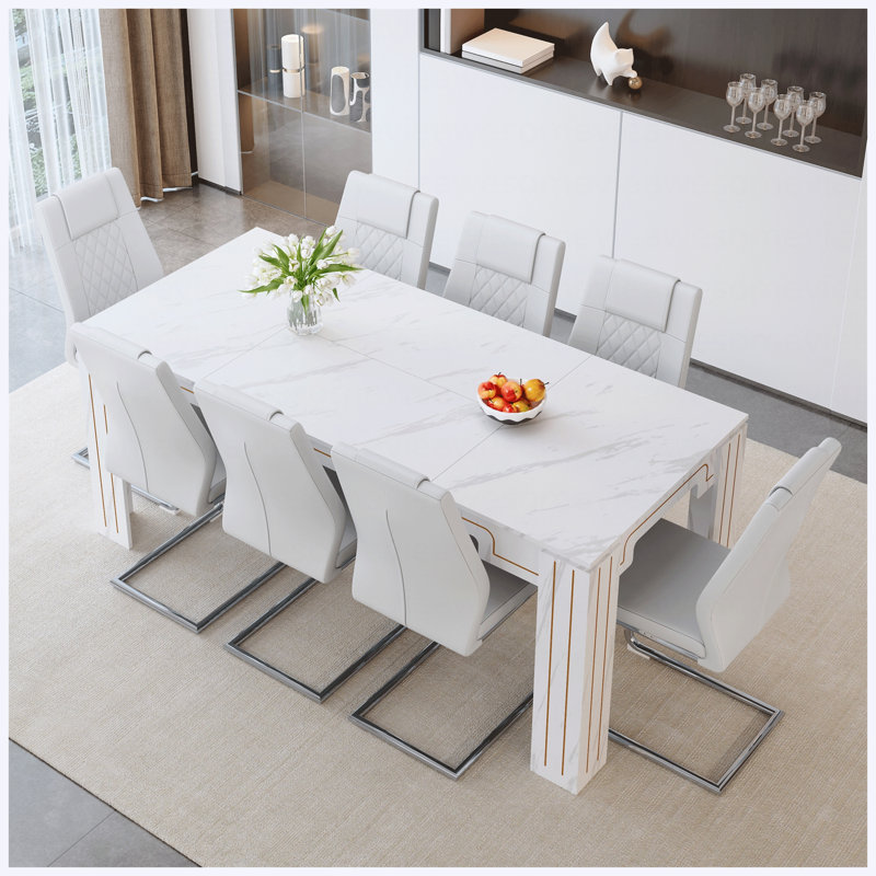 Ensemble de table de salle à manger en MDF de 71 po x 31,5 po avec 8 chaises en polyuréthane blanc, pieds en métal argenté