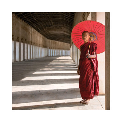 Buddhist Monk With Red Umbrella, Bagan, Myanmar by Jan Becke - Wrapped Canvas Print